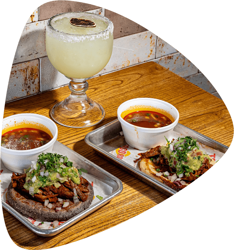 Margarita and tacos in a Taco Rock guitar pick
